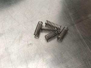 Sprężyna wałka olejowego RICOH MPC300 AA063460